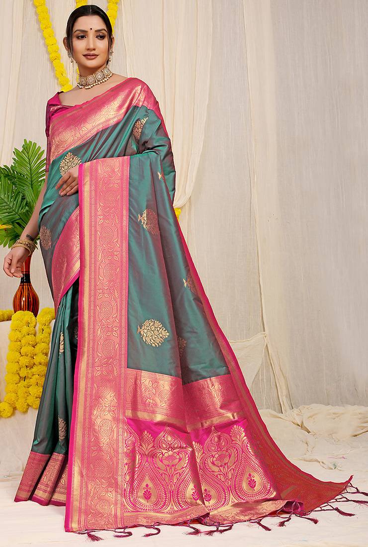 Teal silk blend kanjivaram saree with rani pink zari border