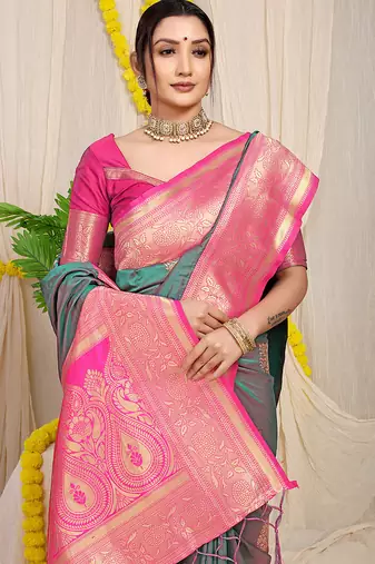 Teal silk blend kanjivaram saree with rani pink zari border