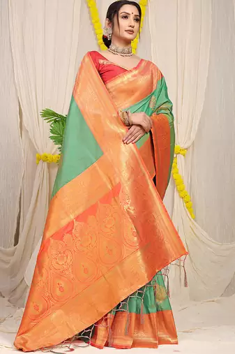 Sea green silk blend kanjivaram saree with peach zari border