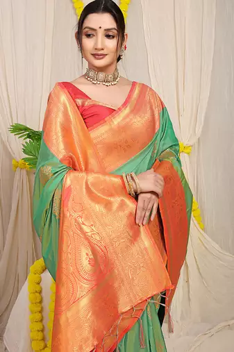 Sea green silk blend kanjivaram saree with peach zari border