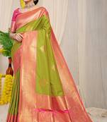 Parrot green silk blend kanjivaram saree with rani pink zari border