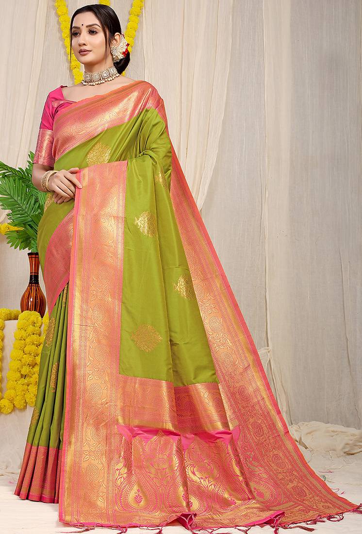 Parrot green silk blend kanjivaram saree with rani pink zari border