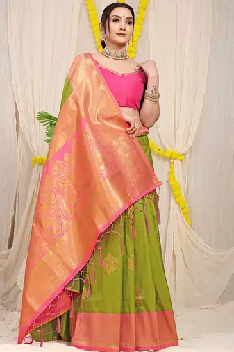 Parrot green silk blend kanjivaram saree with rani pink zari border