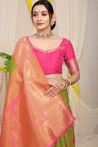 Parrot green silk blend kanjivaram saree with rani pink zari border