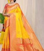 Yellow silk blend kanjivaram saree with peach zari border