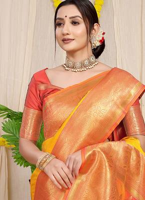 Yellow silk blend kanjivaram saree with peach zari border 3