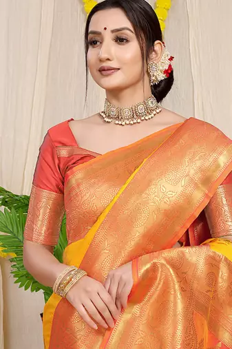 Yellow silk blend kanjivaram saree with peach zari border