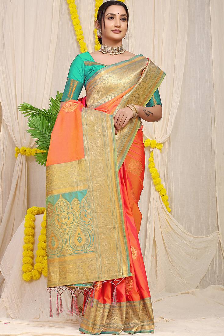 Coral orange silk blend kanjivaram saree with turquoise zari border