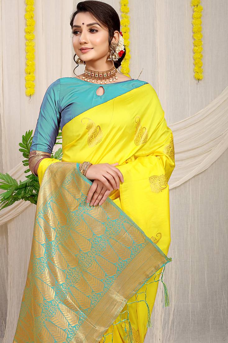 Yellow silk blend saree with rich zari paisley weaving & sea green contrast border