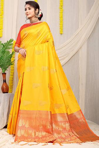 Yellow silk blend saree with rich zari paisley weaving & red contrast border
