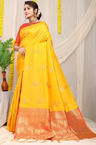 Yellow silk blend saree with rich zari paisley weaving & red contrast border