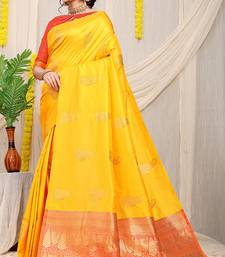 Yellow silk blend saree with rich zari paisley weaving & red contrast border