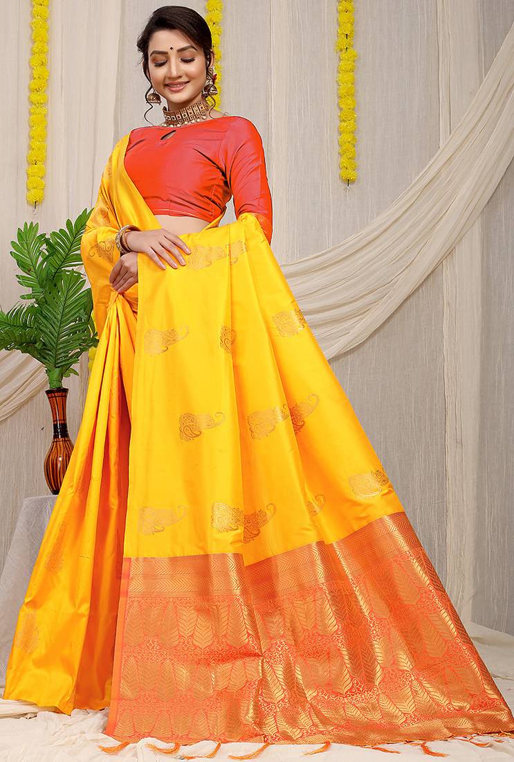 Yellow silk blend saree with rich zari paisley weaving & red contrast border