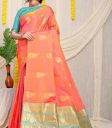 Peach silk blend saree with rich zari paisley weaving & turquoise contrast border