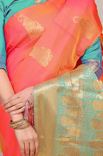 Peach silk blend saree with rich zari paisley weaving & turquoise contrast border