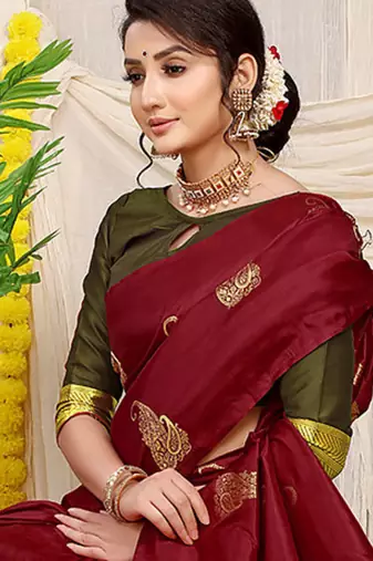 Maroon silk blend saree with rich zari paisley weaving & olive green contrast border