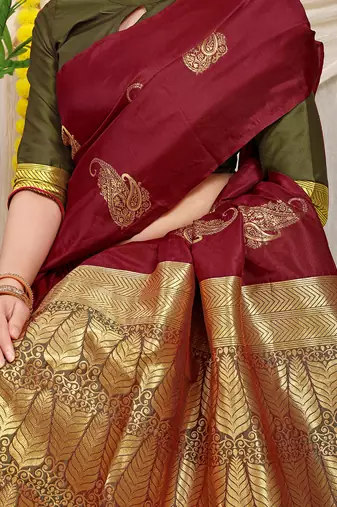 Maroon silk blend saree with rich zari paisley weaving & olive green contrast border