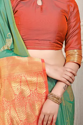 Sea green silk blend saree with rich zari paisley weaving & orange contrast border
