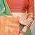 Sea green silk blend saree with rich zari paisley weaving & orange contrast border