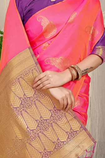 Rani pink silk blend saree with rich zari paisley weaving & purple contrast border