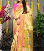 Cream yellow paithani silk blend saree with  pink border and peacock pallu