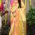 Cream yellow paithani silk blend saree with  pink border and peacock pallu