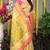 Cream yellow paithani silk blend saree with  pink border and peacock pallu