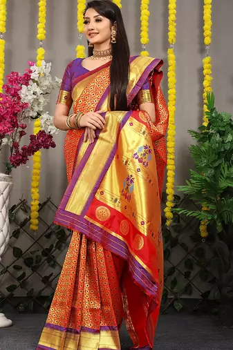 Red paithani silk blend saree with  purple border and peacock pallu