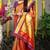 Red paithani silk blend saree with  purple border and peacock pallu