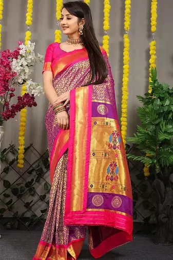 Purple paithani silk blend saree with  rani pink border and peacock pallu