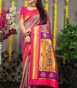 Purple paithani silk blend saree with  rani pink border and peacock pallu