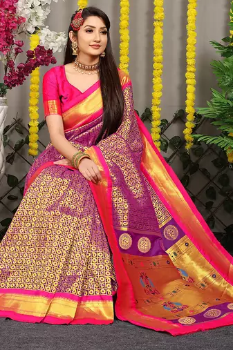 Purple paithani silk blend saree with  rani pink border and peacock pallu