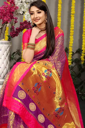 Purple paithani silk blend saree with  rani pink border and peacock pallu