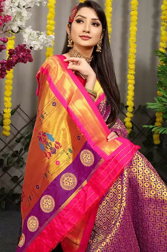 Purple paithani silk blend saree with  rani pink border and peacock pallu