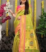Parrot green paithani silk blend saree with  rani pink border and peacock pallu