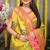 Parrot green paithani silk blend saree with  rani pink border and peacock pallu