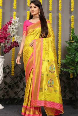 Yellow paithani silk blend saree with  rani pink border and peacock pallu 1