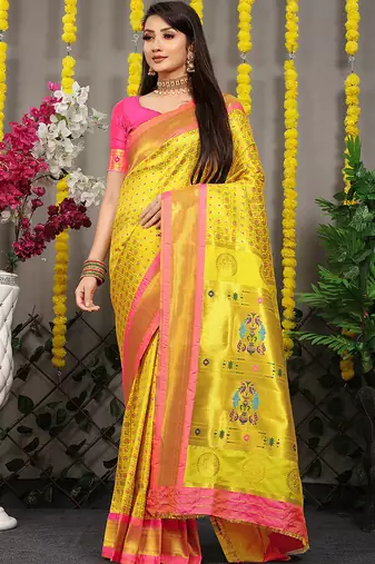 Yellow paithani silk blend saree with  rani pink border and peacock pallu