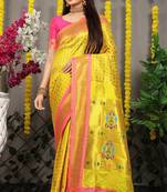 Yellow paithani silk blend saree with  rani pink border and peacock pallu