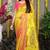 Yellow paithani silk blend saree with  rani pink border and peacock pallu