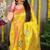 Yellow paithani silk blend saree with  rani pink border and peacock pallu