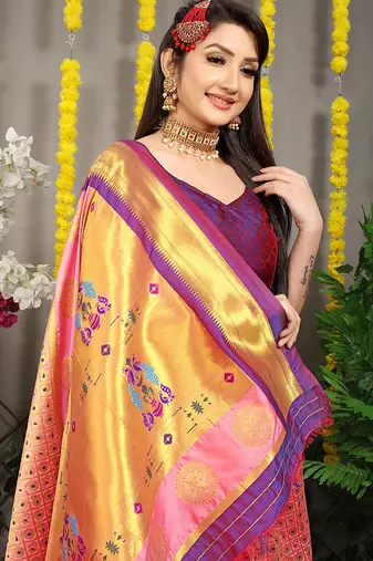 Peach paithani silk blend saree with  purple border and peacock pallu