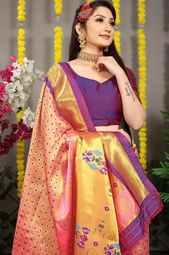Peach paithani silk blend saree with  purple border and peacock pallu