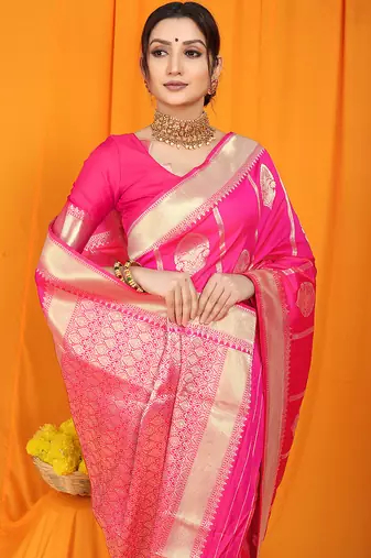 Rani pink banarasi silk blend saree with rich zari border & buttas