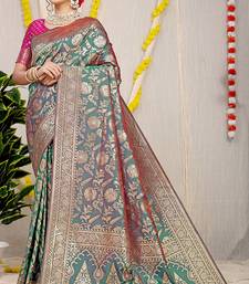 Teal green banarasi silk blend saree with all-over floral zari jaal work