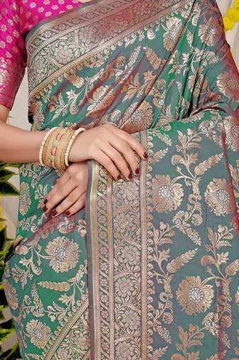 Teal green banarasi silk blend saree with all-over floral zari jaal work