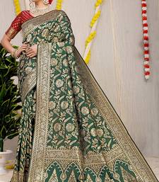 Bottle green banarasi silk blend saree with all-over floral zari jaal work