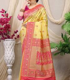Yellow banarasi silk blend saree with rich zari woven border
