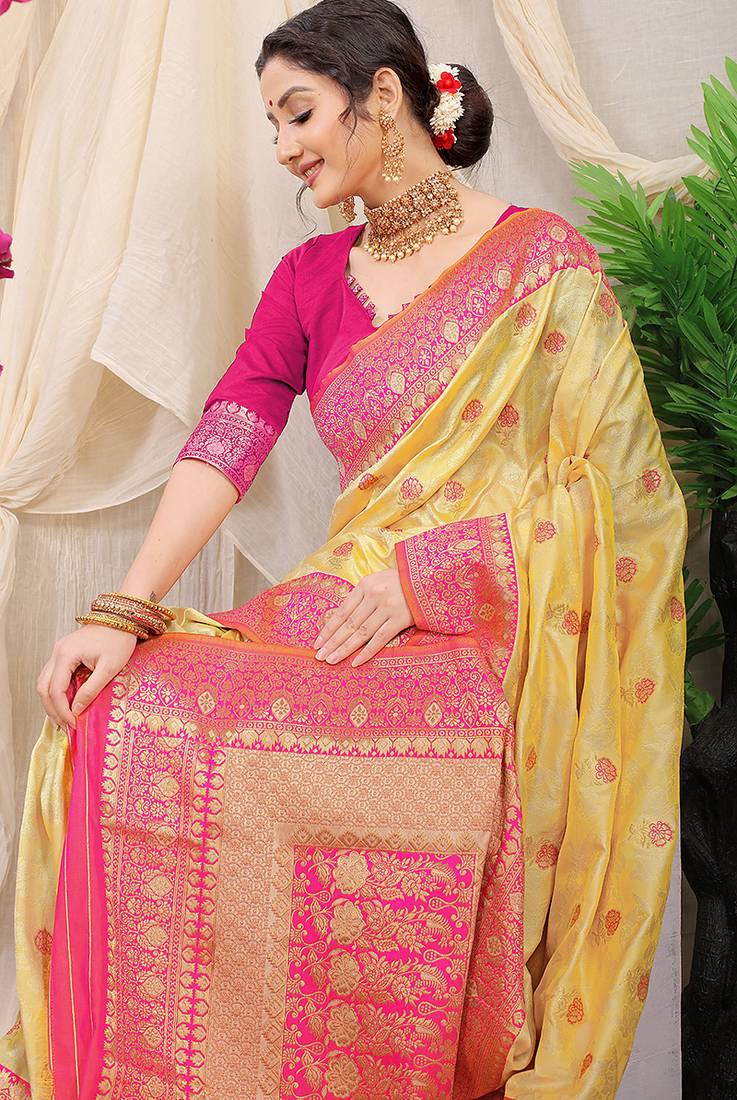 Yellow banarasi silk blend saree with rich zari woven border