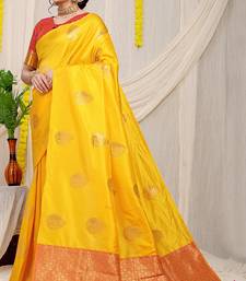 Yellow banarasi silk blend saree with zari buttas & green zari border